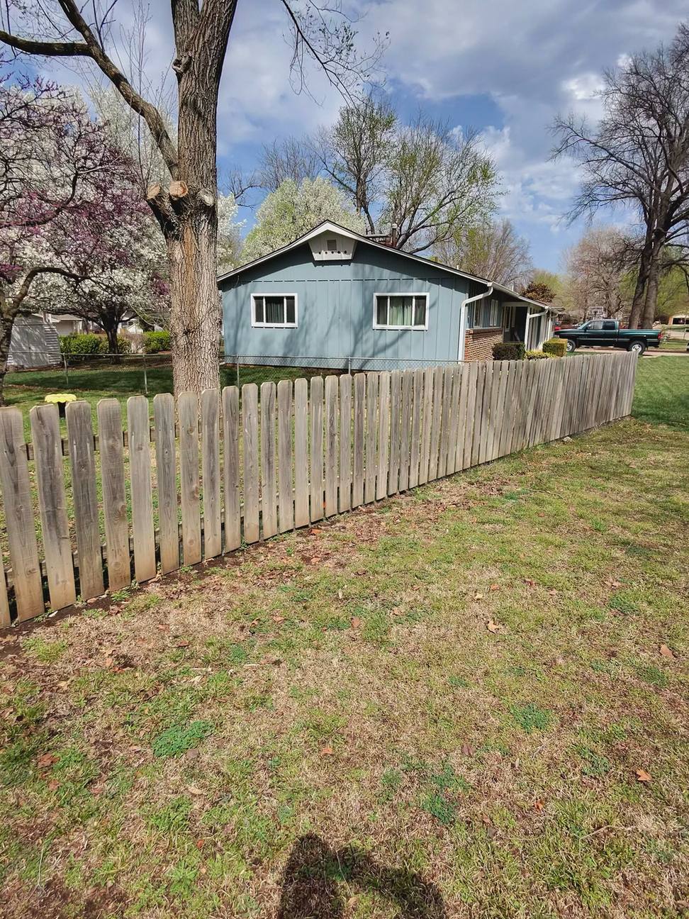 Gray weathered wood fence before cleaning, El Dorado, KS
