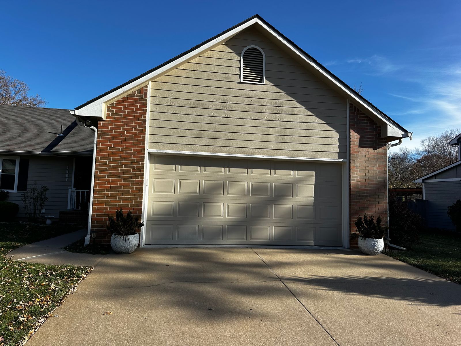 Garage siding before house washing, El Dorado, KS