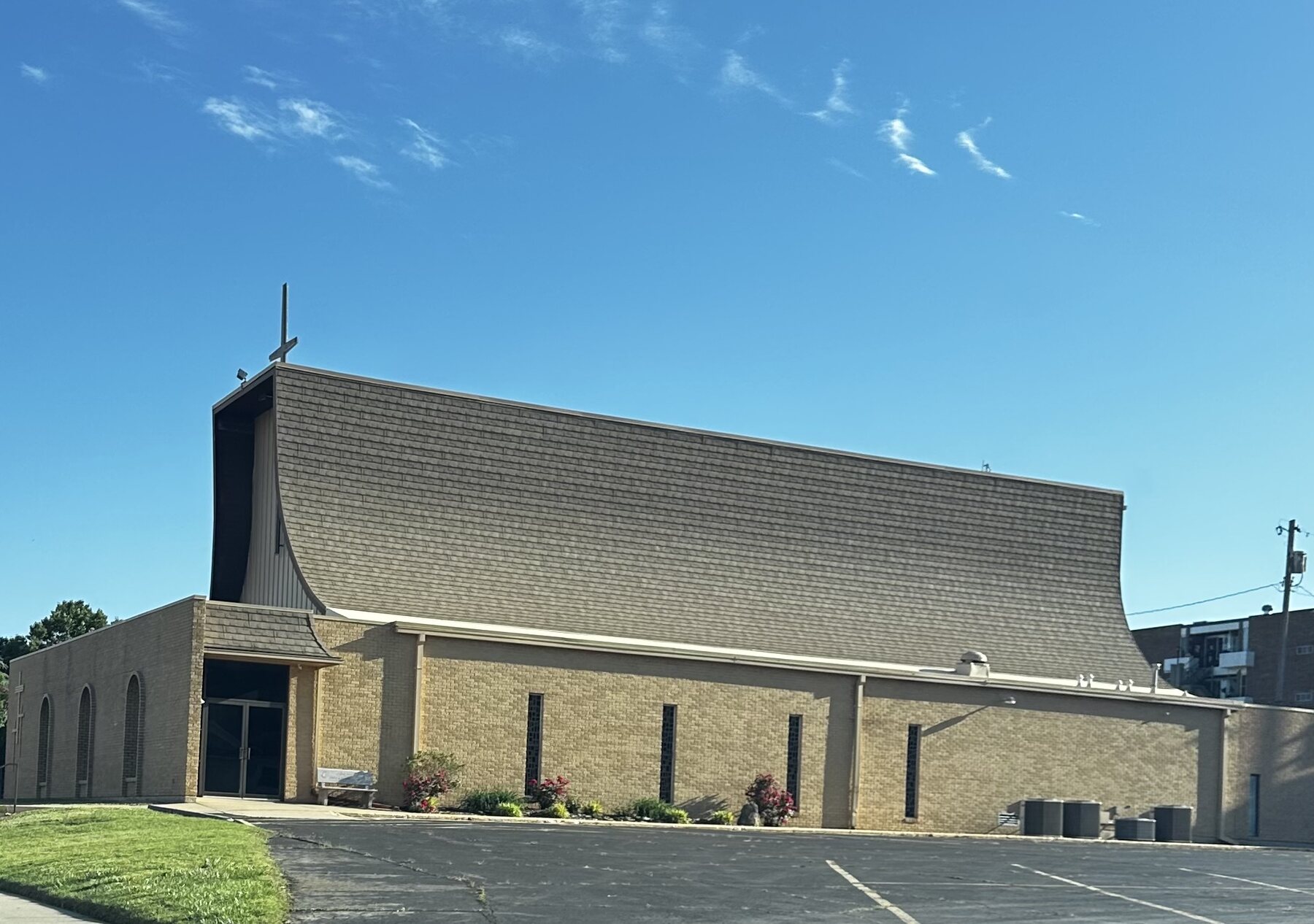 Clean church roof above the entrance after professional roof washing