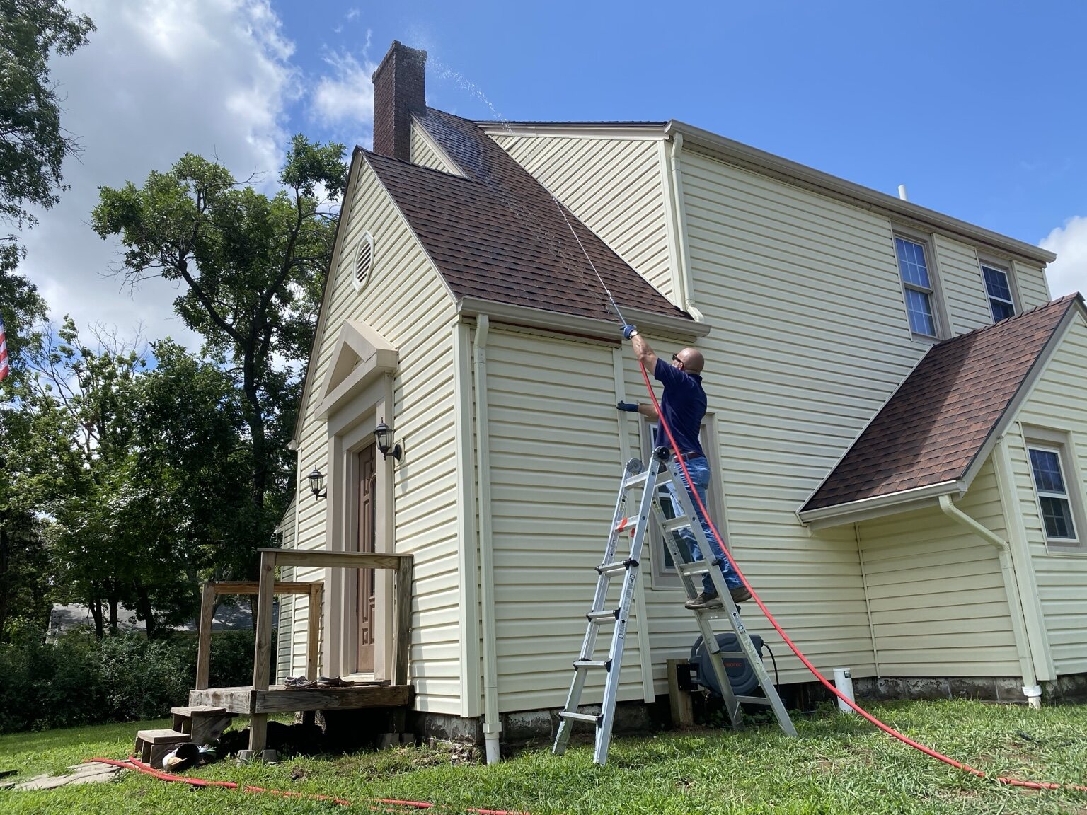 Buffalo Pressure Washing technician soft washing a Wichita-area home