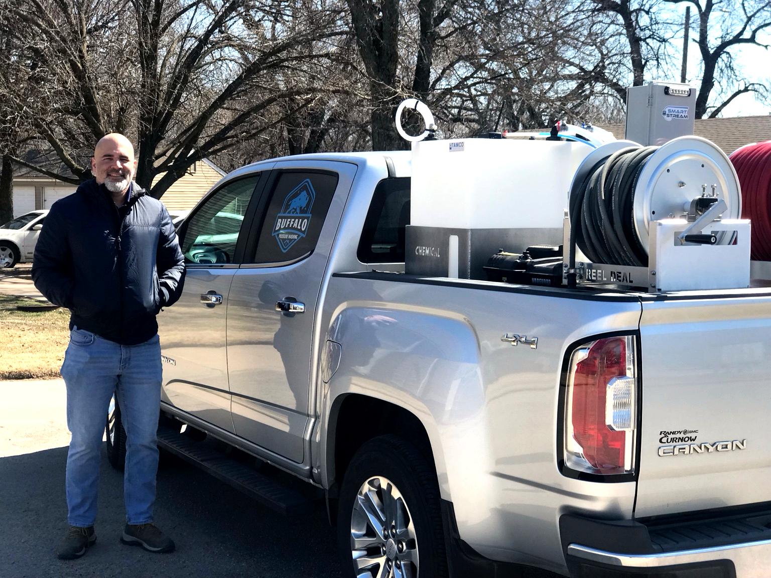 David Jones beside the Buffalo Pressure Washing truck and soft-wash equipment
